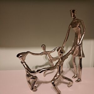 DAYNA B. Mother playing with children sculpture